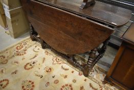 A period oak gateleg table having bobbin style turned frame, width approx. 137cm