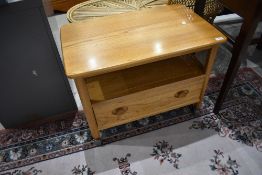 A modern Ercol TV table, could be used as an occasional coffee or side table, width drawer to