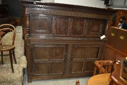 A period oak court cupboard having typical decoration, width approx. 190cm