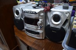 A Panasonic CD Stereo System , with 5 CD changer and twin cassette decks, model SA-AK18, includes