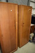 A pair of vintage golden oak 'left and right' wardrobes, possibly Gomme