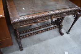 A Victorian oak console table having carved edge , double frieze drawer and twist leg supports