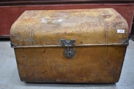 A traditional tin trunk, of compact size