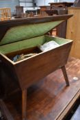 A mid century sewing box table and contents