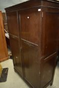 An early 20th Century dark oak wardrobe