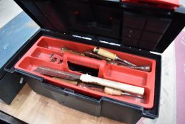 A plastic toolbox and contents