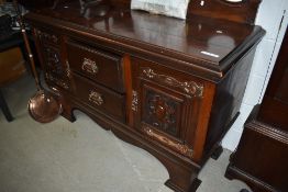 A Victorian sideboard with copper handles