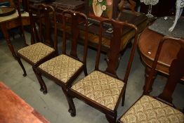 A set of four Queen Anne style mahogany vase back dining chairs