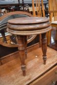 A 19th Century stool or table having triple turned legs