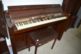 An Eavestaff Pianette mini piano and stool
