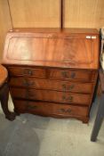 A reproduction yew wood bureau