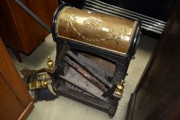 A Victorian Nautilus Grate, cast and brass fireplace, No 8172, of scrolled design, as favoured by