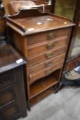 A 19th Century stained frame music cabinet, in need of restoration
