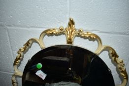 A decorative gilt edged mirror
