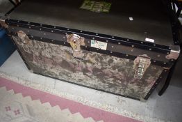 A vintage travel trunk, in a military style, with RAF address labels