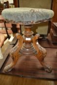 A Victorian swivel piano stool