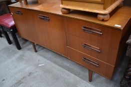 A vintage teak effect sideboard, space influence