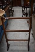 An early 20th Century mahogany folding clothes maid/towel rail