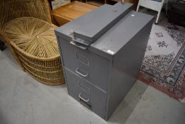 A vintage two drawer filing chest with additional security system