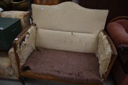 A traditional stripped high back settee having Queen Anne style legs