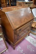 A vintage walnut bureau