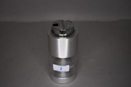 A mid century atomic designed table top cigarette lighter