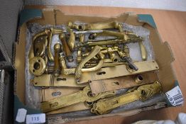 A selection of brass door furniture and handles