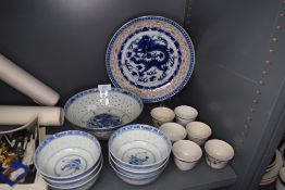 A selection of Chinese porcelain rice and saki bowls including Dragon decorated