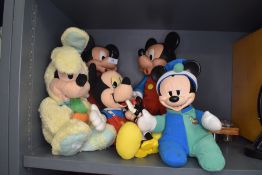 A selection of Disney cuddly soft toys including Mickey Mouse