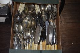 A selection of loose cutlery and flat wares
