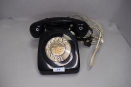 A vintage telephone set in black GPO