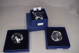 A selection of Swarovski crystal glass paper weights in the form of shells