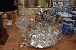 A collection of glass and plated ware including decanters, ink wells,flat ware and more.