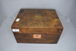 A Burr wood case writers compendium with fitted interior