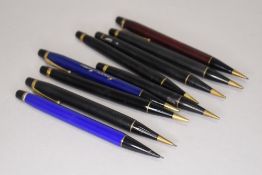 A selection of propelling pencils advertising various companies