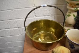 A brass cast jam pan with cast iron handle