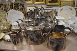 A collection of plated ware and pewter including tea pots, basin and jug.