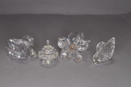A selection of Swarovski crystal glass wares including Swan and cake figures