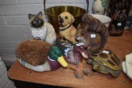 A selection of garden ornament figures including turtle and cat