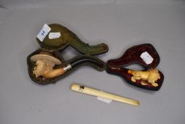 Two 19th century meerschaum carved pipes and a charoot