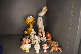 A selection of figures and figurines including Beswick and Wade