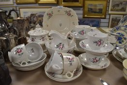 A mid 19th century partial tea service including cups and saucers, jug, basin and more, possibly