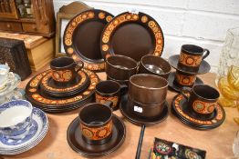 A part tea and dinner service by Kiln Craft in a mid century print
