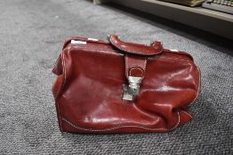 A red leather Gladstone or doctors style bag, handmade in Italy.