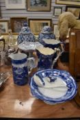 A mixed lot of blue and white ware including jugs,tazza's and ginger jars.