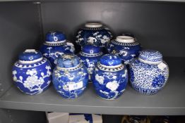 A selection of Chinese porcelain ginger jars some being hand decorated with cherry blossom