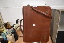 A leather bound satchel or carry case bag