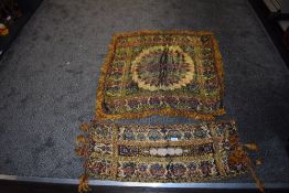 Two vintage fringed ethnic cloths in vibrant colours.