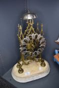A late Victorian Skeleton clock having brass mechanism with chime on marble base