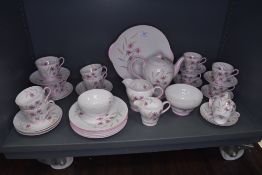 A part tea service by Shelley in a floral printed pink design